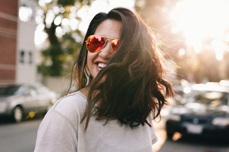 smiling woman in sunglases