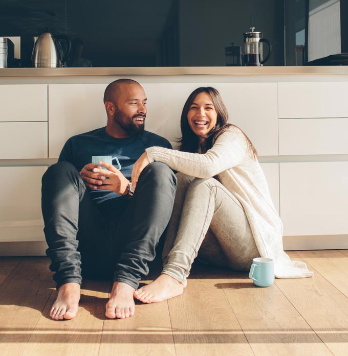 couple drinking coffee in the kitchen