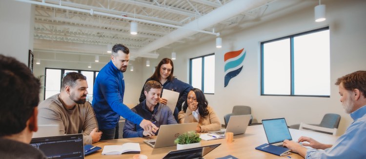 Purpose Financial employees meeting in a board room analyzing results