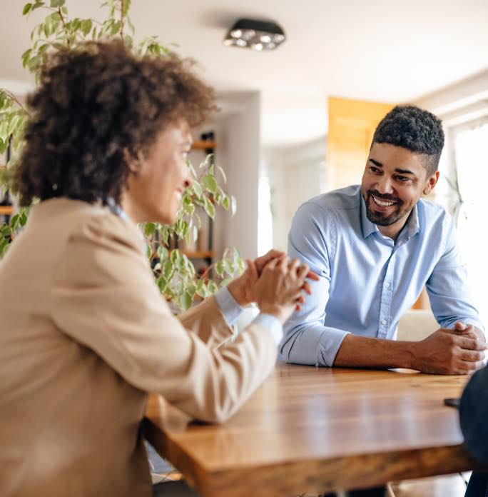 People sitting at a table in their home office